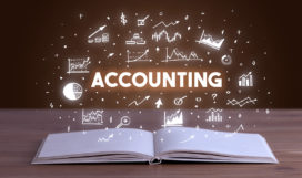 ACCOUNTING inscription coming out from an open book, business concept